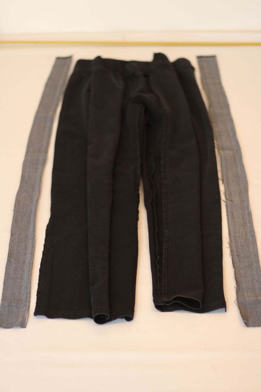 Lay side strips next to pants