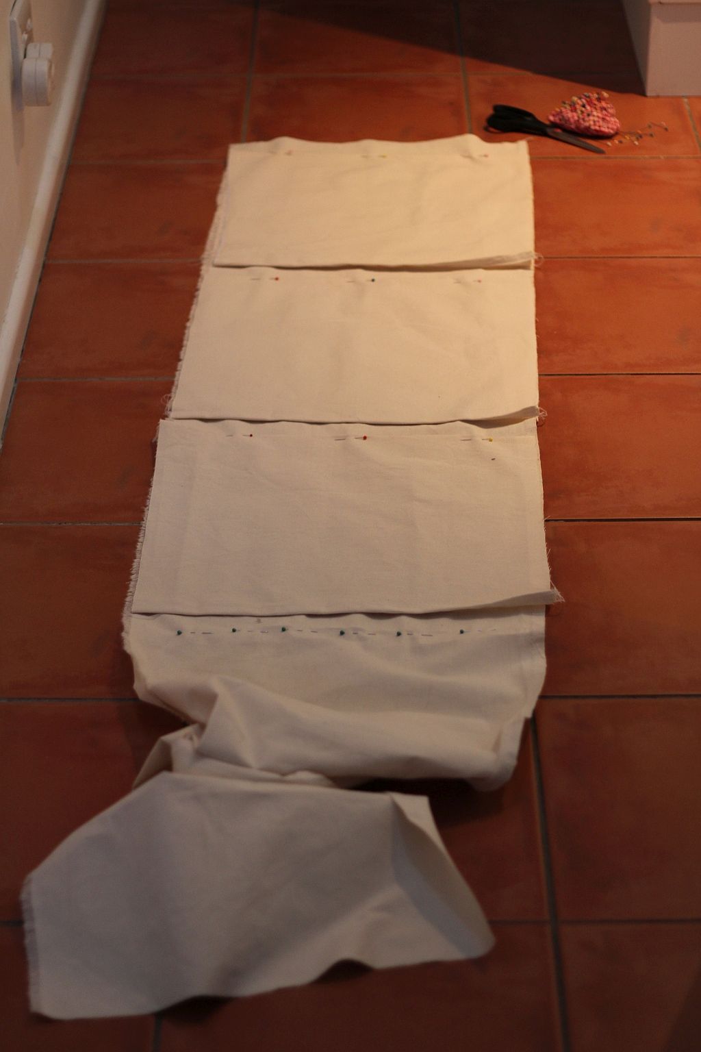 Pin pockets to one half of laundry bag